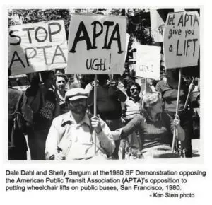 A black and white photo of Shelley and protesters holding signs saying 